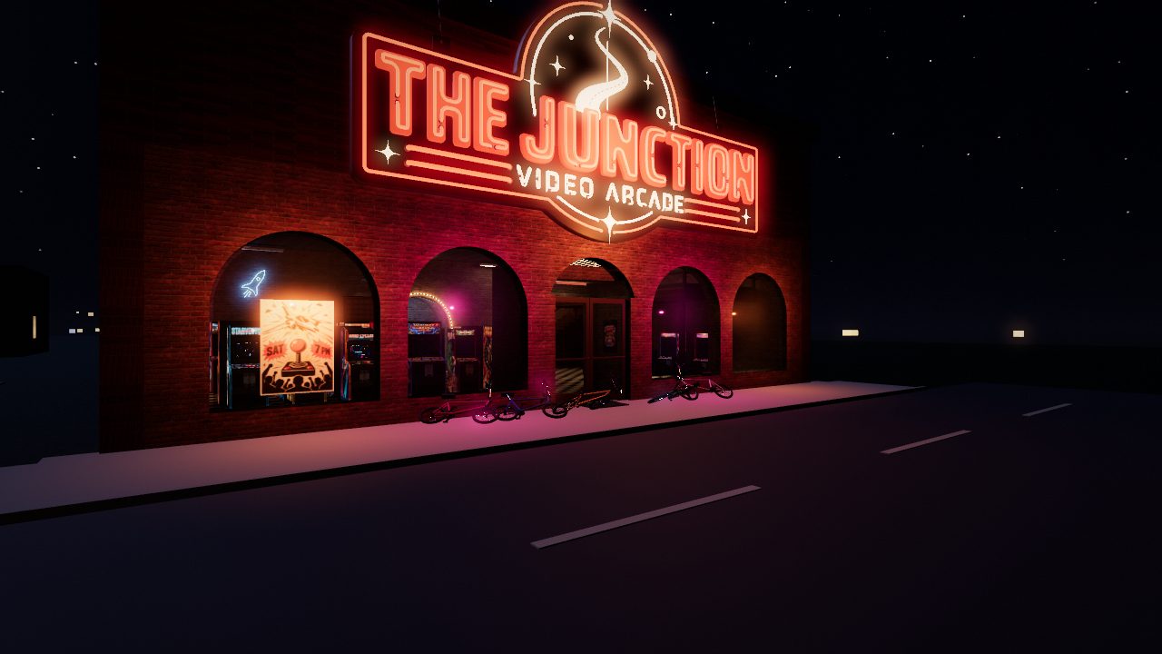 THE JUNCTION video arcade at night, its red neon sign lit over a row of arched windows